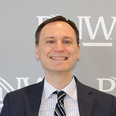 James Seidler in a jacket and tie